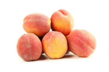 Fresh peaches fruit isolated on a white