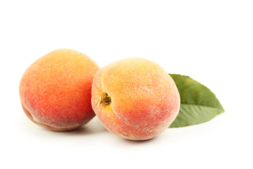 Fresh peaches fruit isolated on a white
