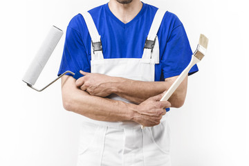 Close up of painter man with paint roller and brush © guerrieroale