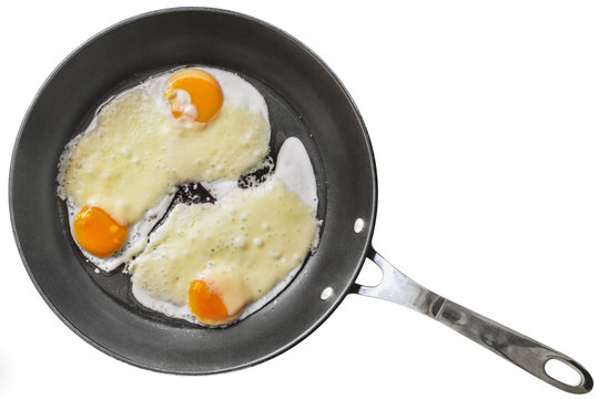 Fried Eggs with Edam Cheese in Teflon Frying Pan Isolated on White Background.