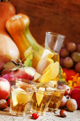 Apple cider in the autumn background, selective focus