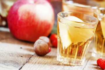 Apple cider in the autumn background, selective focus