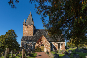 Fototapeta na wymiar Old church with trees, Finland, Aland Islands, Aland Islands, Finstrom