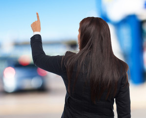 cool business-woman pointing up