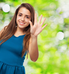 portrait of an elegant young girl counting with her fingers