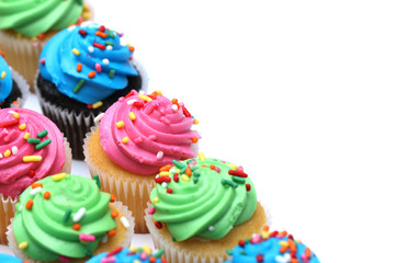 Multicolored Cupcakes Isolated on a White Background