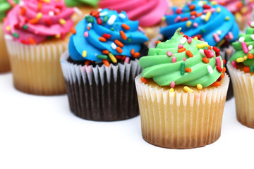 Multicolored Cupcakes Isolated on a White Background