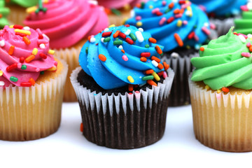 Multicolored Cupcakes Isolated on a White Background