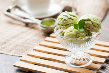 Green Tea Ice Cream on white wood board