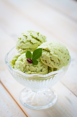 Green Tea Ice Cream on white wood board