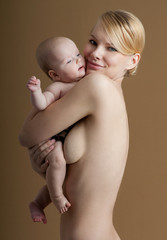Young mother with a charming baby.Happy family. Mom's love and t