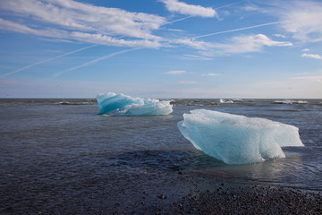 Stranded icebergs on a lava beach