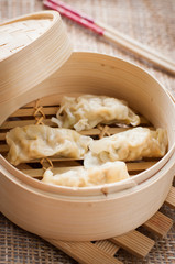chinese dumplings on bamboo steamer