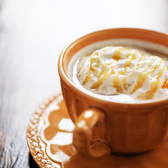 pumpkin spiced latte coffee drink with caramel and cream