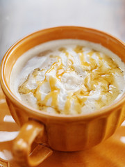pumpkin spiced latte coffe drink with caramel and cream