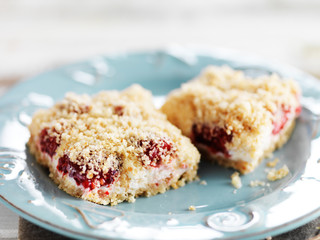 homemade raspberry cheesecake with pie crust crumbs