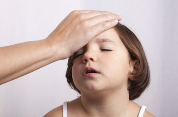 Fototapeta premium Measuring temperature with hand