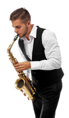 Fototapeta premium Happy saxophonist plays music on sax in elegant suit on white background