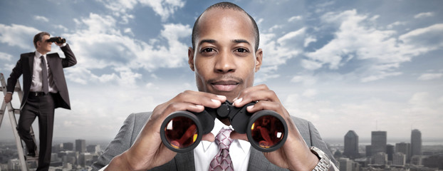 African-American businessman with binoculars.