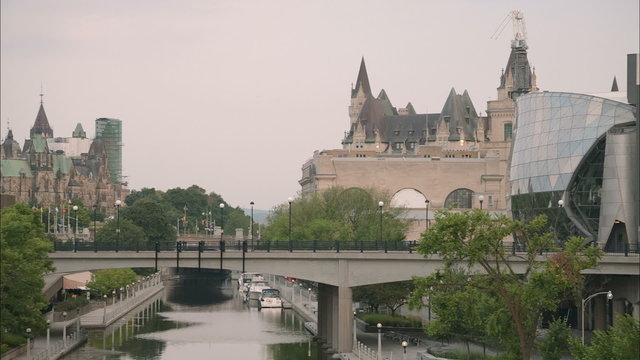 Panoramic View of Ottawa Canal in an early summer morning with Chateau Laurier and Parliament Hill in the background
