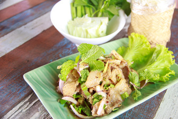 Stock Photo:.Thai cuisine spicy pork salad, Moo Nam Tok.