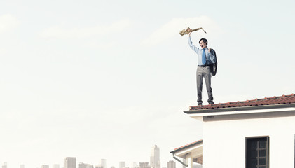 Handsome saxophonist. Concept image