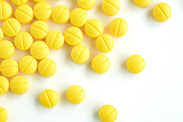 Small medicine tablets (or pills) on white background