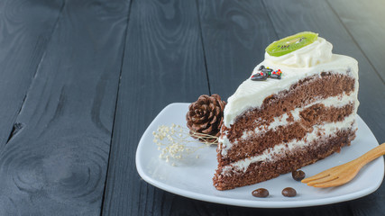 chocolate cake in dish on wooden