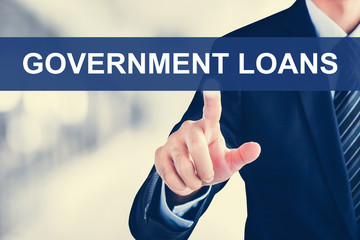 Businessman hand touching GOVERNMENT LOANS tab on virtual screen