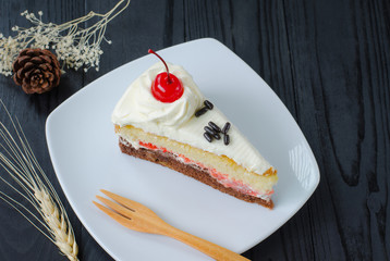 chocolate cake in dish on wooden