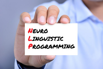 Neuro Linguistic Programming (or NLP) message on the card shown by a man