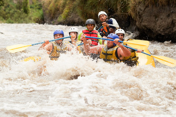 Experience the thrill of rafting on Patate River in Ecuador with a group of dynamic young men as they shoot through the rapids from water level.