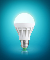 Glowinng LED bulb on blue background