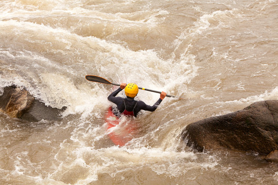 Discover the exhilarating world of an active kayaker braving the tumultuous waters a testament to the human spirit's resilience and the profound understanding of hydrodynamics in action