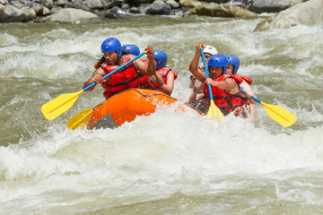 A team of extreme sports enthusiasts navigating through turbulent whitewater rapids on a raft, surrounded by the rushing white river water.