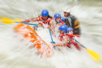 A group of adventurers navigating through the intense rapids of a white water river, feeling the rush of adrenaline on their thrilling rafting expedition. - obrazy, fototapety, plakaty