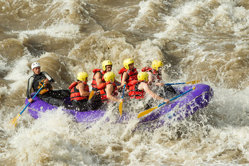 A white water rafting guide navigates a thrilling ride down the Pastaza River in Ecuador.