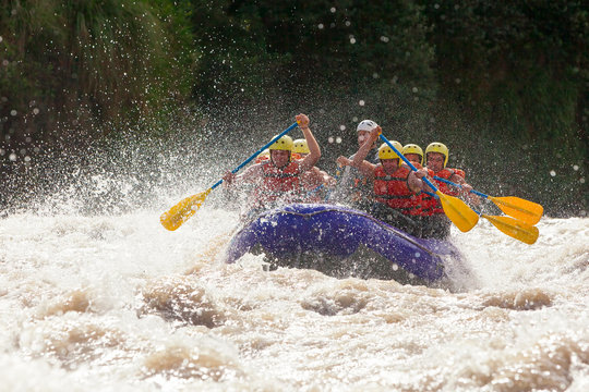 raft water sport white team whitewater rapids river extreme teamwork fun union of mixed pilgrim human and lady with guided by professional pilot on whitewater waterway rafting in ecuador raft water s