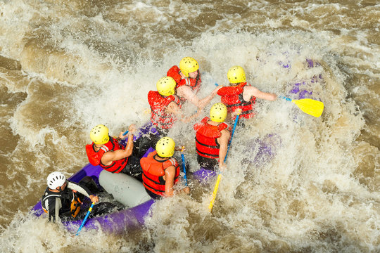 A diverse ensemble of tourists shepherded by an experienced rafting captain braves the tumultuous waters of Ecuador's rivers embarking on a riveting whitewater adventure