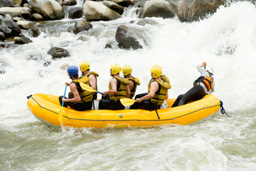 A professional white-water rafting adventure in Ecuador, as the raft glides through the rushing water with excitement and adrenaline.