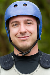 Adult man dressed in customary water sports attire suitable for various aquatic activities informed by insights from academic research in recreation and tourism studies