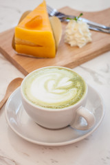 Hot green tea latte, orange cake