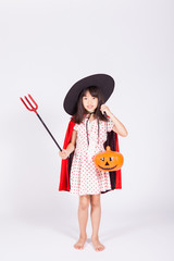 little girl in black hat  with halloween pumpkin