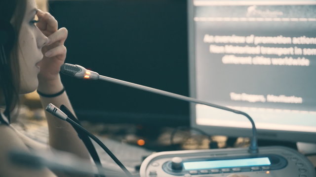 woman translator working in a conference room on large business