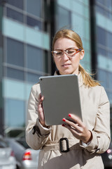 Young businesswoman with tablet