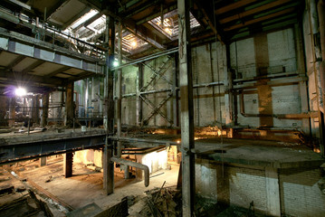 Fototapeta na wymiar Old creepy, dark, decaying, destructive, dirty factory