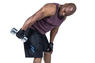 Fit man exercising with dumbbell 