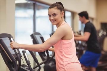 Fit people working out using machines