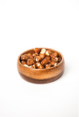 Hazelnuts in a Wooden Bowl on White Background