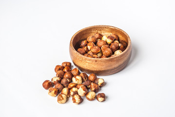 Hazelnuts in a Wooden Bowl on White Background